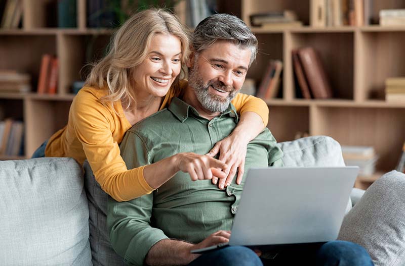 Woman using laptop on coffee table